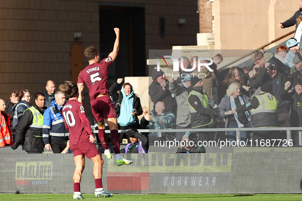 John Stones of Manchester City celebrates with Jack Grealish after scoring his side's second goal during the Premier League match between Wo...