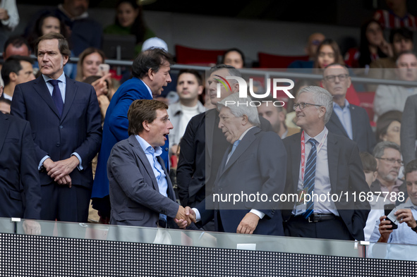 Jose Luis Martinez Almeida, mayor of Madrid, cheers Enrique Cerezo, president of Atletico de Madrid, during the La Liga EA Sports 2024/25 fo...