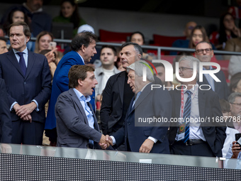 Jose Luis Martinez Almeida, mayor of Madrid, cheers Enrique Cerezo, president of Atletico de Madrid, during the La Liga EA Sports 2024/25 fo...