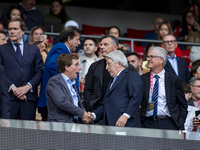 Jose Luis Martinez Almeida, mayor of Madrid, cheers Enrique Cerezo, president of Atletico de Madrid, during the La Liga EA Sports 2024/25 fo...