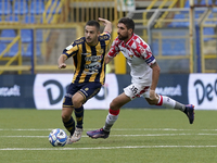 Davide Buglio of SS Juve Stabia competes for the ball with Matteo Bianchetti of US Cremonese during the Serie B match between SS Juve Stabia...