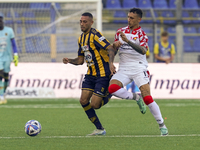 Kevin Piscopo of SS Juve Stabia competes for the ball with Michele Collocolo of Cremonese during the Serie B match between SS Juve Stabia an...