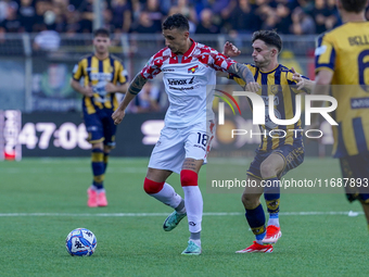 Michele Collocolo of Cremonese competes for the ball with Christian Pierobon of Cremonese during the Serie B match between SS Juve Stabia an...