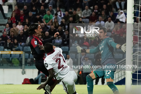 Ali Dembele (Torino FC), Simone Scuffet (#22 Cagliari Calcio), and Tommaso Augello (#27 Cagliari Calcio) participate in the Serie A TIM matc...