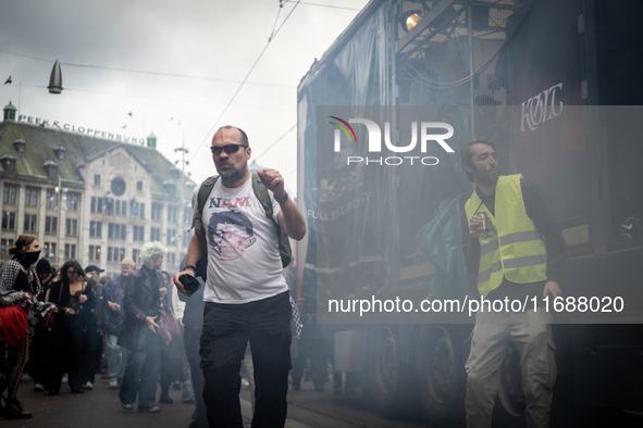 ADEV participants dance through the streets of Amsterdam, Netherlands, on October 19, 2024.  On Saturday, October 19, 2024, the ADEV (Amster...