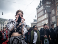 ADEV participants dance through the streets of Amsterdam, Netherlands, on October 19, 2024.  On Saturday, October 19, 2024, the ADEV (Amster...