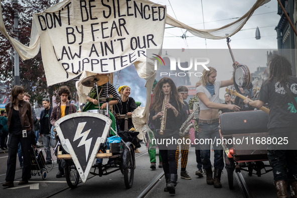 ADEV participants dance through the streets of Amsterdam, Netherlands, on October 19, 2024.  On Saturday, October 19, 2024, the ADEV (Amster...