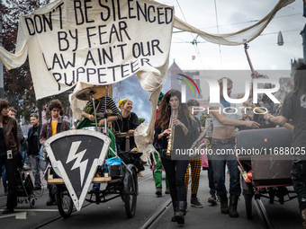 ADEV participants dance through the streets of Amsterdam, Netherlands, on October 19, 2024.  On Saturday, October 19, 2024, the ADEV (Amster...