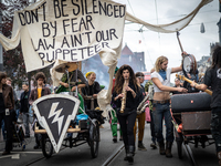 ADEV participants dance through the streets of Amsterdam, Netherlands, on October 19, 2024.  On Saturday, October 19, 2024, the ADEV (Amster...