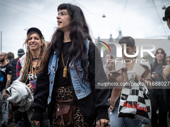 ADEV participants dance through the streets of Amsterdam, Netherlands, on October 19, 2024.  On Saturday, October 19, 2024, the ADEV (Amster...