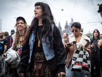 ADEV participants dance through the streets of Amsterdam, Netherlands, on October 19, 2024.  On Saturday, October 19, 2024, the ADEV (Amster...