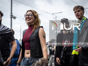 ADEV participants dance through the streets of Amsterdam, Netherlands, on October 19, 2024.  On Saturday, October 19, 2024, the ADEV (Amster...