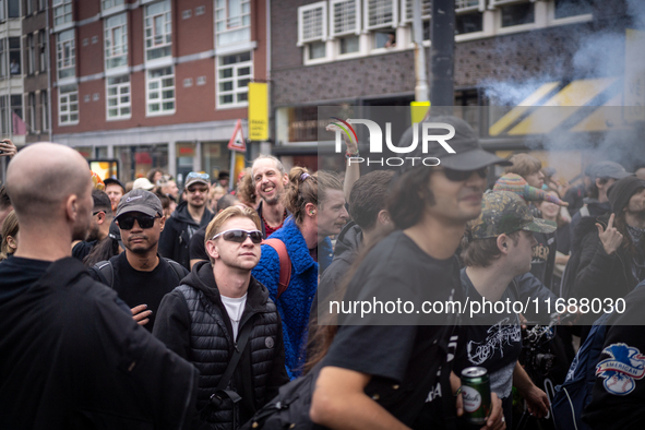 ADEV participants dance through the streets of Amsterdam, Netherlands, on October 19, 2024.  On Saturday, October 19, 2024, the ADEV (Amster...