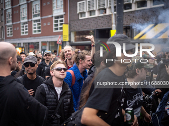 ADEV participants dance through the streets of Amsterdam, Netherlands, on October 19, 2024.  On Saturday, October 19, 2024, the ADEV (Amster...