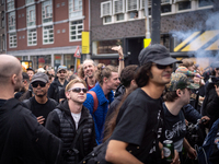 ADEV participants dance through the streets of Amsterdam, Netherlands, on October 19, 2024.  On Saturday, October 19, 2024, the ADEV (Amster...