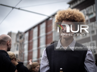 ADEV participants dance through the streets of Amsterdam, Netherlands, on October 19, 2024.  On Saturday, October 19, 2024, the ADEV (Amster...