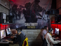 Iranian youths play video games at a gaming venue at night in Tabriz, Iran, on October 18, 2024, amid global concerns about war between Iran...