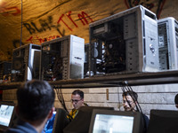 Iranian youths play video games at a gaming venue at night in Tabriz, Iran, on October 18, 2024, amid global concerns about war between Iran...