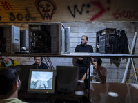 Iranian youths play video games at a gaming venue at night in Tabriz, Iran, on October 18, 2024, amid global concerns about war between Iran...