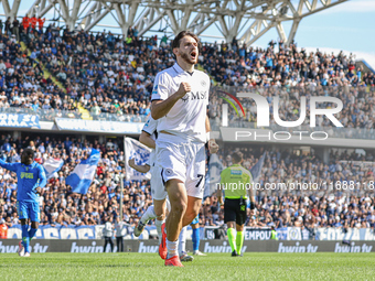 Khvicha Kvaratskhelia celebrates with teammates after scoring a goal during the Serie A match between Empoli FC and SSC Napoli in Empoli, It...