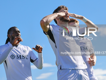 Khvicha Kvaratskhelia celebrates with teammates after scoring a goal during the Serie A match between Empoli FC and SSC Napoli in Empoli, It...