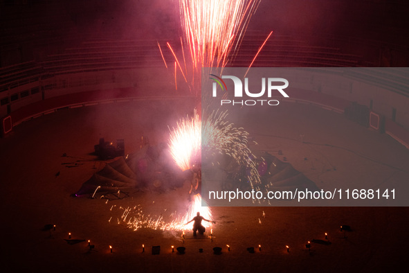 A Zoolians artist captivates the audience with a fiery performance during the closing show of '????????'?????: Arcanes' in the Arles arenas....