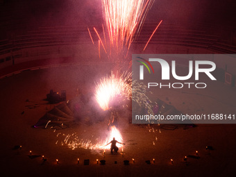 A Zoolians artist captivates the audience with a fiery performance during the closing show of '????????'?????: Arcanes' in the Arles arenas....