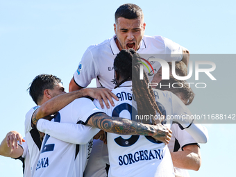 Khvicha Kvaratskhelia celebrates with teammates after scoring a goal during the Serie A match between Empoli FC and SSC Napoli in Empoli, It...