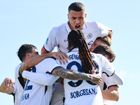 Khvicha Kvaratskhelia celebrates with teammates after scoring a goal during the Serie A match between Empoli FC and SSC Napoli in Empoli, It...