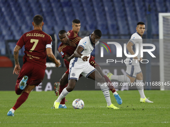 Inter's Marcus Thuram and Roma's Evan Ndicka play during the Serie A soccer match between AS Roma and Inter FC at Stadio Olimpico in Rome, I...