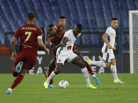 Inter's Marcus Thuram and Roma's Evan Ndicka play during the Serie A soccer match between AS Roma and Inter FC at Stadio Olimpico in Rome, I...