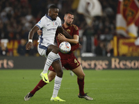 Inter's Marcus Thuram and Roma's Bryan Cristante participate in the Serie A soccer match between AS Roma and Inter FC at Stadio Olimpico in...