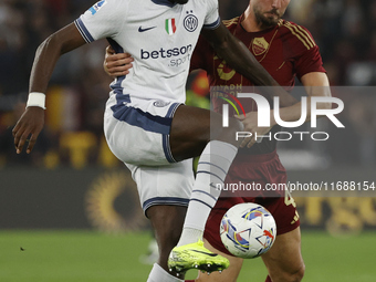 Inter's Marcus Thuram and Roma's Bryan Cristante participate in the Serie A soccer match between AS Roma and Inter FC at Stadio Olimpico in...