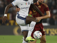 Inter's Marcus Thuram and Roma's Bryan Cristante participate in the Serie A soccer match between AS Roma and Inter FC at Stadio Olimpico in...