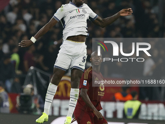 Inter's Marcus Thuram and Roma's Evan Ndicka participate in the Serie A soccer match between AS Roma and Inter FC at Stadio Olimpico in Rome...