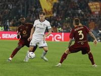 Roma's Kone Soule Malvano and Inter's Nicolo Barella participate in the Serie A soccer match between AS Roma and Inter FC at Stadio Olimpico...