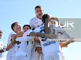 Khvicha Kvaratskhelia celebrates with teammates after scoring a goal during the Serie A match between Empoli FC and SSC Napoli in Empoli, It...