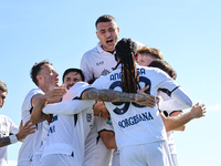 Khvicha Kvaratskhelia celebrates with teammates after scoring a goal during the Serie A match between Empoli FC and SSC Napoli in Empoli, It...