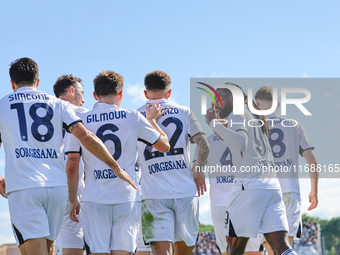 Khvicha Kvaratskhelia celebrates with teammates after scoring a goal during the Serie A match between Empoli FC and SSC Napoli in Empoli, It...