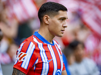 Nahuel Molina of Atletico de Madrid enters the field during the La Liga EA Sports 2024/25 football match between Atletico de Madrid and CD L...