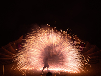 A Zoolians artist captivates the audience with a fiery performance during the closing show of '????????'?????: Arcanes' in the Arles arenas....