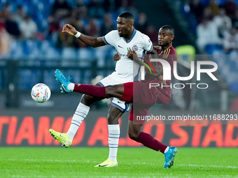 Evan Ndicka of AS Roma and Marcus Thuram of FC Internazionale compete for the ball during the Serie A Enilive match between AS Roma and FC I...