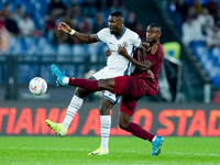 Evan Ndicka of AS Roma and Marcus Thuram of FC Internazionale compete for the ball during the Serie A Enilive match between AS Roma and FC I...