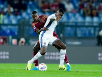 Evan Ndicka of AS Roma and Marcus Thuram of FC Internazionale compete for the ball during the Serie A Enilive match between AS Roma and FC I...