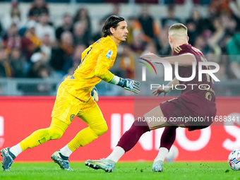 Yann Sommer of FC Internazionale and Artem Dovbyk of AS Roma during the Serie A Enilive match between AS Roma and FC Internazionale at Stadi...