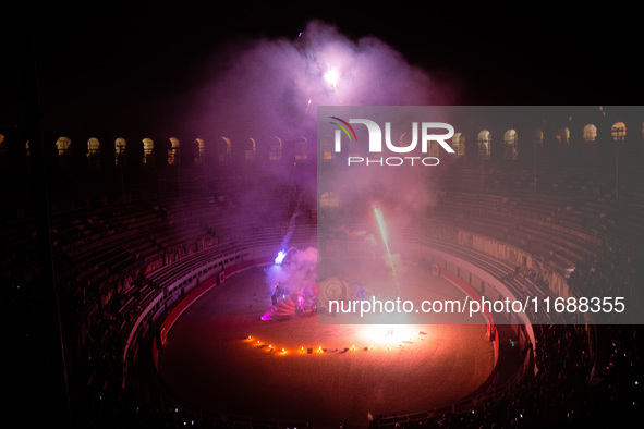 A Zoolians artist captivates the audience with a fiery performance during the closing show of '????????'?????: Arcanes' in the Arles arenas....