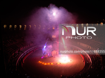 A Zoolians artist captivates the audience with a fiery performance during the closing show of '????????'?????: Arcanes' in the Arles arenas....