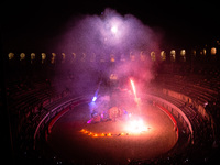 A Zoolians artist captivates the audience with a fiery performance during the closing show of '????????'?????: Arcanes' in the Arles arenas....