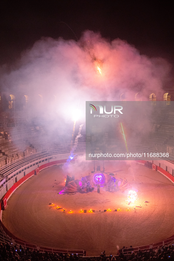 A Zoolians artist captivates the audience with a fiery performance during the closing show of '????????'?????: Arcanes' in the Arles arenas....