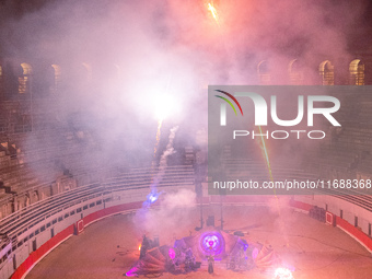 A Zoolians artist captivates the audience with a fiery performance during the closing show of '????????'?????: Arcanes' in the Arles arenas....